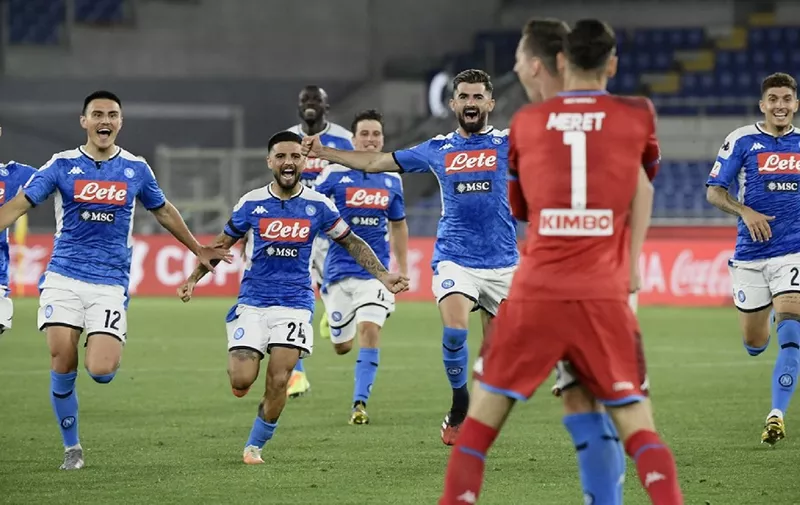 (From L) Napoli's Italian forward Matteo Politano, Napoli's Macedonian defender Eljif Elmas, Napoli's Italian forward Lorenzo Insigne Napoli's Macedonian defender Eljif Elmas and Napoli's Italian defender Giovanni Di Lorenzo (R) run to celebrate with Napoli's Polish forward Arkadiusz Milik after he scored the winning goal of the penalty shootout for Napoli to win the TIM Italian Cup (Coppa Italia) final football match Napoli vs Juventus on June 17, 2020 at the Olympic stadium in Rome, played behind closed doors as the country gradually eases the lockdown aimed at curbing the spread of the COVID-19 infection, caused by the novel coronavirus. (Photo by Filippo MONTEFORTE / AFP)