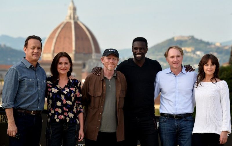 (L-R) US actor Tom Hanks, Danish actress Sidse Babett Knudsen, US film director Ron Howard, French actor Omar Sy, US writer Dan Brown and British actress Felicity Jones pose during the photocall of the film ''Inferno'' in Florence on May 11, 2015. AFP PHOTO / TIZIANA FABI
