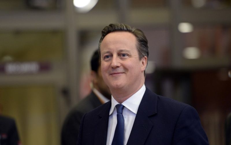 British Prime Minister David Cameron leaves the working dinner at the end of an European Union (EU) summit in Brussels, on February 19, 2016. 
European leaders sealed a deal with the UK after hours of haggling at a marathon summit, paving the way for a referendum on whether Britain will stay in the EU. The European Union's two top figures, Donald Tusk and Jean-Claude Juncker, presented its 28 leaders with draft proposals at a long-delayed dinner after hours of painstaking face-to-face talks on an issue that threatened place in the union.  / AFP / THIERRY CHARLIER