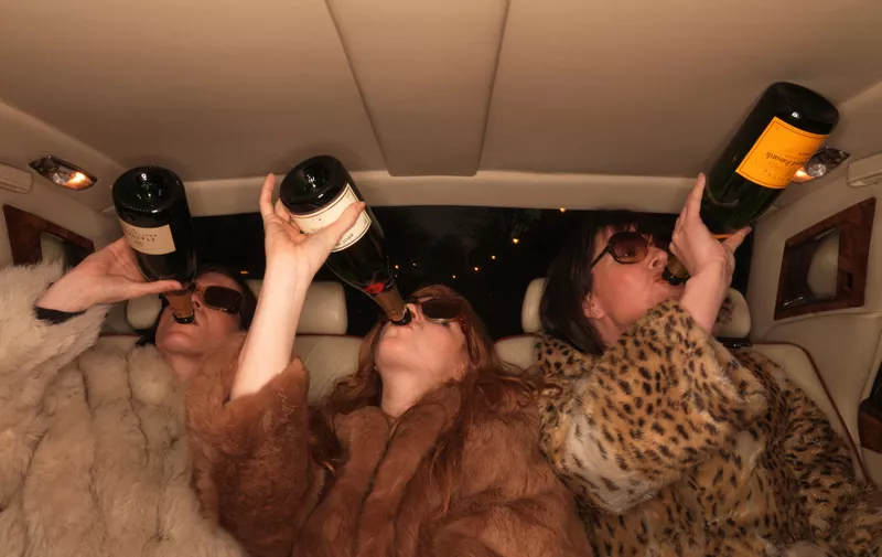 Three women drinking champagne in car,Image: 295599434, License: Royalty-free, Restrictions: Specifically, you may not use the Images in ways or contexts that might reasonably be construed as pornographic, defamatory, libellous or otherwise unlawful;
Specifically, you may not use images depicting any model in any unduly controversial or unflattering context, unless accompanied with a statement indicating that the person is a model and the images are being used for illustrative purposes only., Model Release: yes
