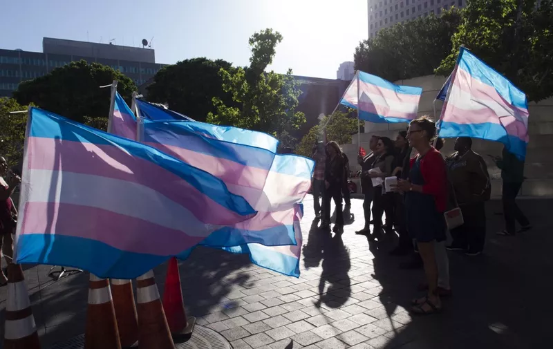 Members of the transgender and gender non-binary community and their allies gather to celebrate  International Transgender Day of Visibility, March 31, 2017 at the Edward R. Roybal Federal Building in Los Angeles, California. International Transgender Day of Visibility is dedicated to celebrating transgender people and raising awareness of discrimination faced by transgender people worldwide. (Photo by Robyn Beck / AFP)