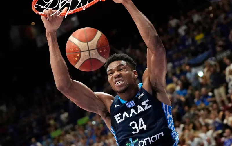 FILE - Greece's Giannis Antetokounmpo scores a basket during the Eurobasket group C basketball match between Estonia and Greece, in Milan, Italy, Thursday, Sept. 8, 2022. Antetokounmpo said Friday, Aug. 11, 2023, that he will not be able to play for Greece at the World Cup that starts in two weeks because of ongoing recovery from knee surgery. (AP Photo/Antonio Calanni, File)