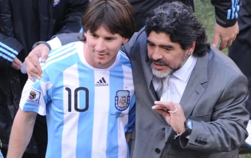 Argentina's coach Diego Maradona (R) and Argentina's striker Lionel Messi speak after their Group B first round 2010 World Cup football match Argentina versus South Korea on June 17, 2010 at Soccer City stadium in Soweto, suburban Johannesburg. Argentina won the match 4-1. NO PUSH TO MOBILE / MOBILE USE SOLELY WITHIN EDITORIAL ARTICLE - AFP PHOTO /