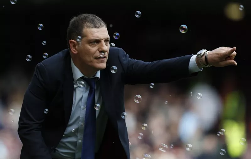 West Ham United's Croatian manager Slaven Bilic shouts instructions to his players from the touchline during the English Premier League football match between West Ham United and Arsenal at The Boleyn Ground in Upton Park, in east London on April 9, 2016. / AFP PHOTO / Ian Kington / RESTRICTED TO EDITORIAL USE. No use with unauthorized audio, video, data, fixture lists, club/league logos or 'live' services. Online in-match use limited to 75 images, no video emulation. No use in betting, games or single club/league/player publications.  /