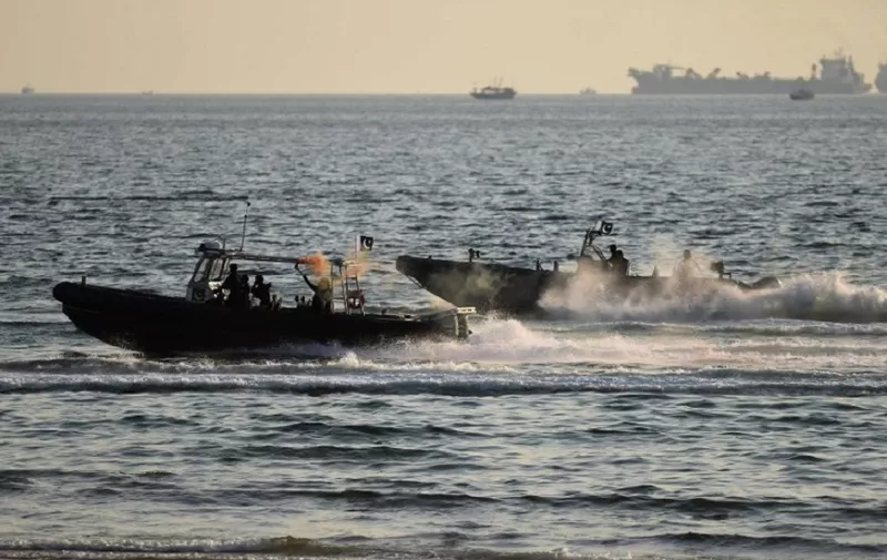 Special Services Group naval commandos take part in the first day of the multinational naval exercise Aman-17 in Karachi on February 11, 2017.
The international exercise will feature harbour and sea phases with a variety of activities, including search and rescue (SAR) operations, gunnery drills, anti-piracy demonstrations, replenishment at sea (RAS) and maritime counter-terrorism demonstrations. / AFP PHOTO / RIZWAN TABASSUM