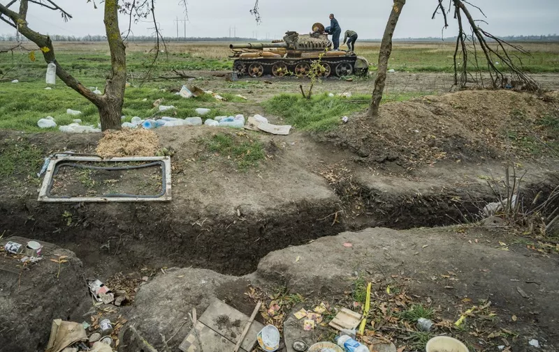 Abandoned trenches and a destroyed tank of the russian army in the outskirts of Myroliubivka, a village liberated by the ukrainian army of the russian occupation in Kherson province, Ukrane. (Photo by Celestino Arce/NurPhoto) (Photo by Celestino Arce / NurPhoto / NurPhoto via AFP)