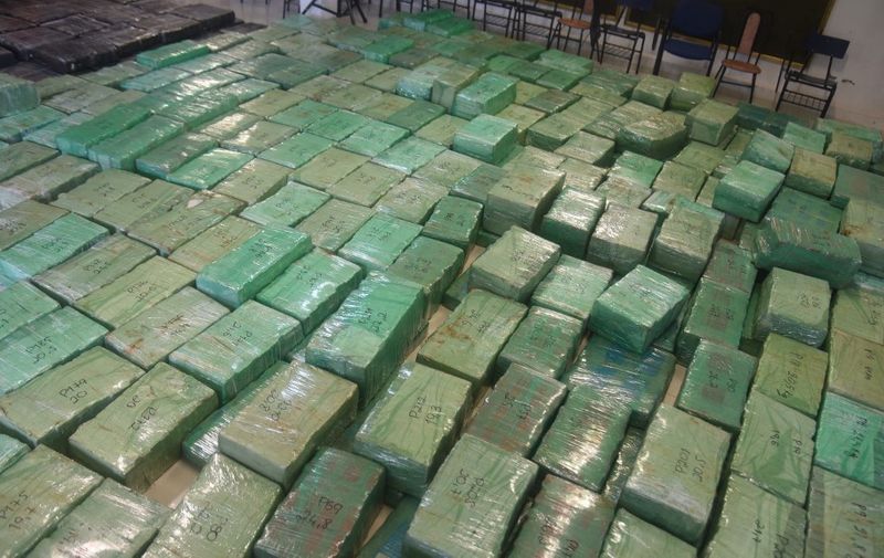 Packages totalling 9453 kg of marijuana which were bound for Argentina and seized during an operation in Villa del Rosario, San Pedro Department, about 250 km north of Asuncion, are presented by Paraguay's National Anti-Drug Secretariat (SENAD) to the press, in the Paraguayan capital on March 19, 2018. (Photo by Norberto DUARTE / AFP)