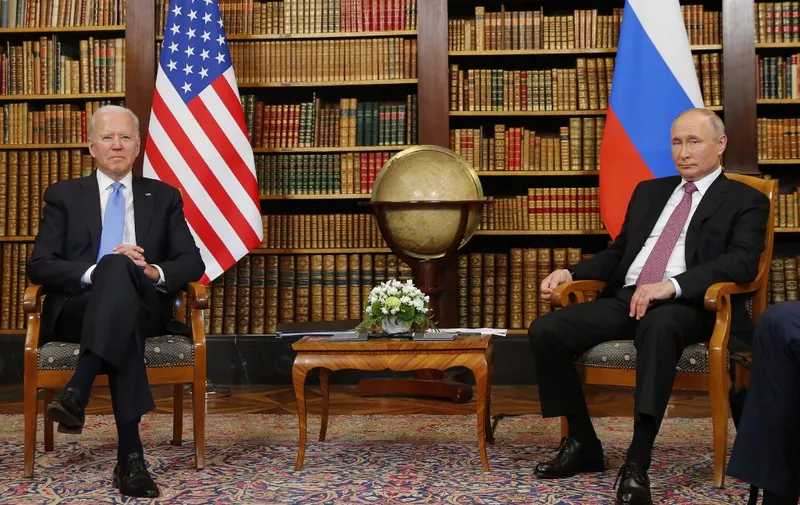 US President Joe Biden (R) meets with Russian President Vladimir Putin (L) at the 'Villa la Grange' in Geneva on June 16, 2021. (Photo by DENIS BALIBOUSE / POOL / AFP)
