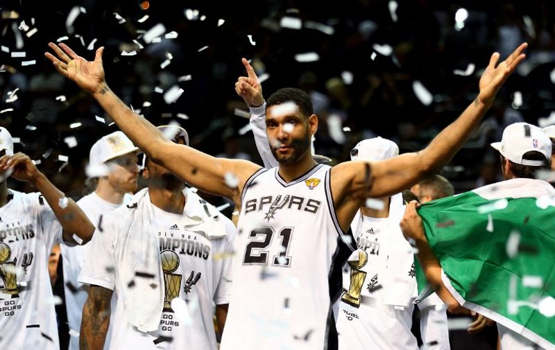 SAN ANTONIO, TX - JUNE 15: Tim Duncan #21 of the San Antonio Spurs celebrates after defeating the Miami Heat in Game Five of the 2014 NBA Finals at the AT&amp;T Center on June 15, 2014 in San Antonio, Texas. NOTE TO USER: User expressly acknowledges and agrees that, by downloading and or using this photograph, User is consenting to the terms and conditions of the Getty Images License Agreement.   Andy Lyons/Getty Images/AFP