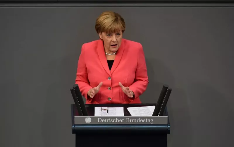 German Chancellor Angela Merkel addresses the Bundestag, the lower house of parliament in Berlin on September 24, 2015. Merkel said that a European Union deal to relocate 120,000 refugees was far from what was necessary to resolve the biggest migrant crisis facing the region since World War II. AFP PHOTO / JOHN MACDOUGALL