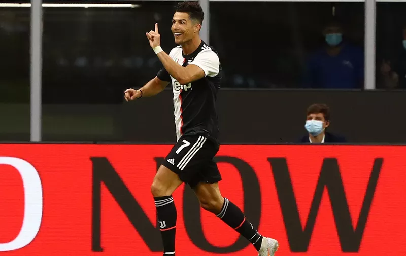 MILAN, ITALY - JULY 07:  Cristiano Ronaldo #7 of Juventus FC celebrates his goal during the Serie A match between AC Milan and Juventus at Stadio Giuseppe Meazza on July 7, 2020 in Milan, Italy.  (Photo by Marco Luzzani/Getty Images)