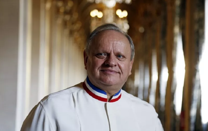 (FILES) In this file photo taken on January 14, 2016 French chef Joel Robuchon poses in a corridor in the Hotel de ville of Paris during the Grand Vermeil award ceremony, rewarding the best chefs of Paris.
French chef, died at the age of 73, on August 6, 2018 according to the French government spokesperson. / AFP PHOTO / FRANCOIS GUILLOT