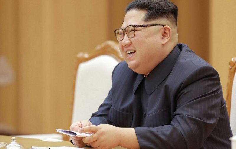 This April 14, 2018 picture released from North Korea's official Korean Central News Agency (KCNA) on April 16, 2018 shows North Korean leader Kim Jong-Un speaking with Song Tao, head of the International Liaison Department of the Central Committee of the Communist Party of China, who led the Chinese art troupe in Pyongyang. / AFP PHOTO / KCNA VIA KNS AND AFP PHOTO / KCNA VIA KNS /  - South Korea OUT / REPUBLIC OF KOREA OUT   ---EDITORS NOTE--- RESTRICTED TO EDITORIAL USE - MANDATORY CREDIT "AFP PHOTO/KCNA VIA KNS" - NO MARKETING NO ADVERTISING CAMPAIGNS - DISTRIBUTED AS A SERVICE TO CLIENTS
THIS PICTURE WAS MADE AVAILABLE BY A THIRD PARTY. AFP CAN NOT INDEPENDENTLY VERIFY THE AUTHENTICITY, LOCATION, DATE AND CONTENT OF THIS IMAGE. THIS PHOTO IS DISTRIBUTED EXACTLY AS RECEIVED BY AFP.  /