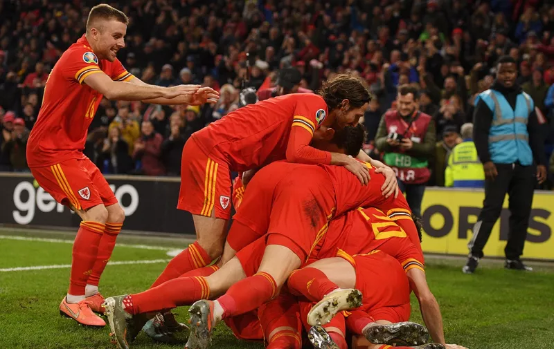 CARDIFF, WALES - NOVEMBER 19: Aaron Ramsey of Wales (obscured) celebrates with his team after he scores his sides second goal during the UEFA Euro 2020 qualifier between Wales and Hungary so at Cardiff City Stadium on November 19, 2019 in Cardiff, Wales. (Photo by Harry Trump/Getty Images)