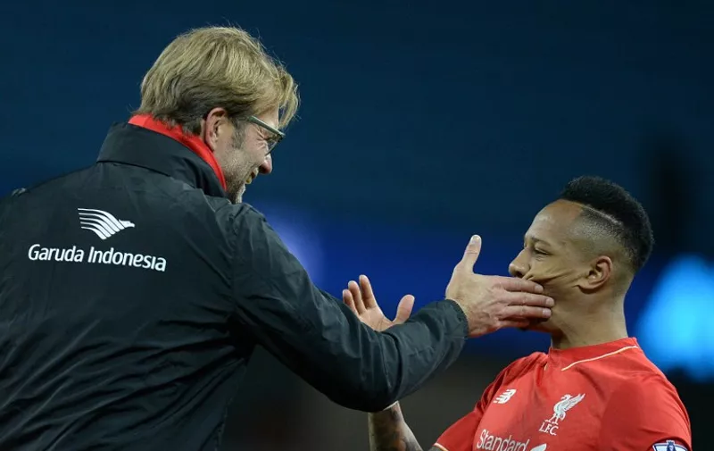 Liverpool's German manager Jurgen Klopp gesture to Liverpool's English defender Nathaniel Clyne after the English Premier League football match between Manchester City and Liverpool at The Etihad stadium in Manchester, north west England on November 21, 2015. Liverpool won the game 4-1. AFP PHOTO / OLI SCARFF

RESTRICTED TO EDITORIAL USE. No use with unauthorized audio, video, data, fixture lists, club/league logos or 'live' services. Online in-match use limited to 75 images, no video emulation. No use in betting, games or single club/league/player publications. / AFP / OLI SCARFF