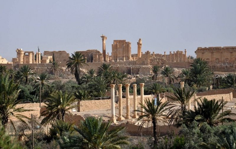 (FILES) - A file picture taken on May 18, 2015 shows the ancient Syrian city of Palmyra, a day after Islamic State (IS) group jihadists fired rockets into the city, killing several people. IS group militants have laid landmines and explosives at the site of the ancient ruins in Palmyra, a monitor said on June 21, 2015, adding the purpose of the move was unclear.  AFP PHOTO / STR