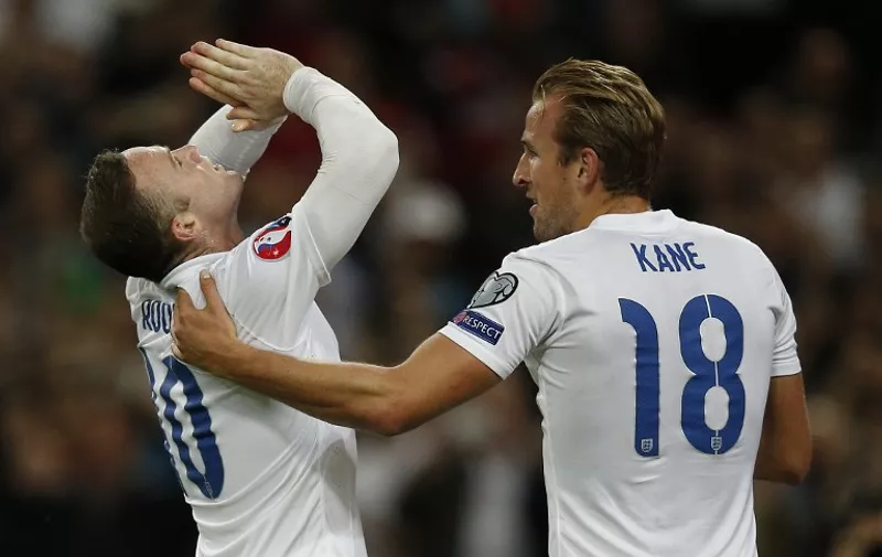 England's striker Wayne Rooney reacts (L) after scoring a penalty, his 50th goal for England, making him the country's all-time goal scorer, during the Euro 2016 qualifying group E football match between England and Switzerland at Wembley Stadium in west London on September 8, 2015.    AFP PHOTO / ADRIAN DENNIS

NOT FOR MARKETING OR ADVERTISING USE / RESTRICTED TO EDITORIAL USE