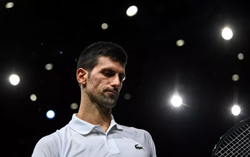 Serbia's Novak Djokovic reacts during the men's single final tennis match against Russia's Daniil Medvedev, on the last day of the ATP Paris Masters at The AccorHotels Arena in Paris on November 7, 2021. (Photo by Anne-Christine POUJOULAT / AFP)