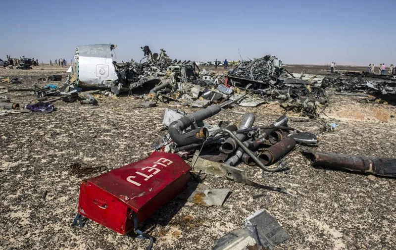 Debris belonging to the A321 Russian airliner are seen at the site of the crash in Wadi al-Zolomat, a mountainous area in Egypt's Sinai Peninsula on November 1, 2015. International investigators began probing why a Russian airliner carrying 224 people crashed in Egypt's Sinai Peninsula, killing everyone on board, as rescue workers widened their search for missing victims. AFP PHOTO / KHALED DESOUKI