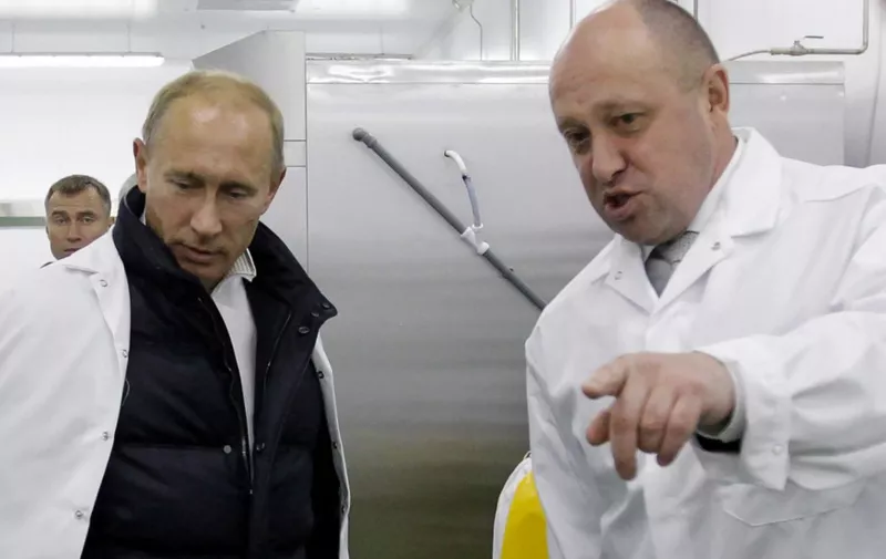 Businessman Yevgeny Prigozhin shows Russian Prime Minister Vladimir Putin his school lunch factory outside Saint Petersburg on September 20, 2010. - Kremlin-linked businessman Yevgeny Prigozhin has filed a lawsuit in an EU court to remove him from the bloc's sanctions list, his company said on December 15, 2020. The European Union in October sanctioned Prigozhin -- nicknamed "Putin's chef" because his company Concord has catered for the Kremlin -- accusing him of undermining peace in Libya by supporting the Wagner Group private military company. (Photo by Alexey DRUZHININ / SPUTNIK / AFP)