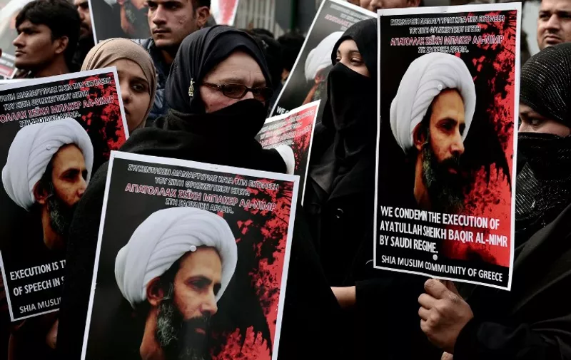 Members of the Shia Muslim community of Greece hold up placards and banners bearing images of prominent Shiite cleric and activist Nimr al-Nimr during a demonstration near the Saudi Arabian embassy in Athens on January 6, 2016, as they condemn Nimr's execution by Saudi authorities. 
Nimr, one of 47 men executed on January 2, was a driving force behind 2011 anti-government protests in Saudi Arabia's Eastern Province. He was arrested in 2012 after calling for two Saudi governorates to be separated from the kingdom. His death sparked Shiite demonstrations in many countries including Iran, where protesters stormed and set fire to the Saudi embassy in Tehran and the kingdom's consulate in second city Mashhad. Riyadh cut ties with Tehran in response and was joined by several of its Sunni Arab allies including Bahrain and Sudan. / AFP / LOUISA GOULIAMAKI