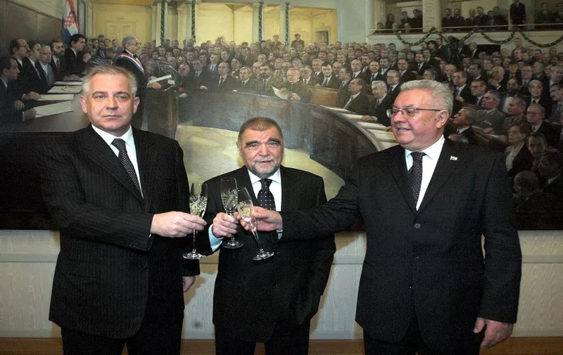 (From L) Croatian Prime ¨Minister-designate Ivo Sanader, President Stipe Mesic and new Parliament Speaker Luka Bebic toast ahead of an inaugural session of the parliament after the November 25 legislative elections 11 January 2008 in Zagreb. Croatia's new parliament held on Friday an inaugural session during which a veteran member of the conservatives who won most of the votes in November elections was elected its speaker.
AFP PHOTO STRINGER (Photo by AFP)