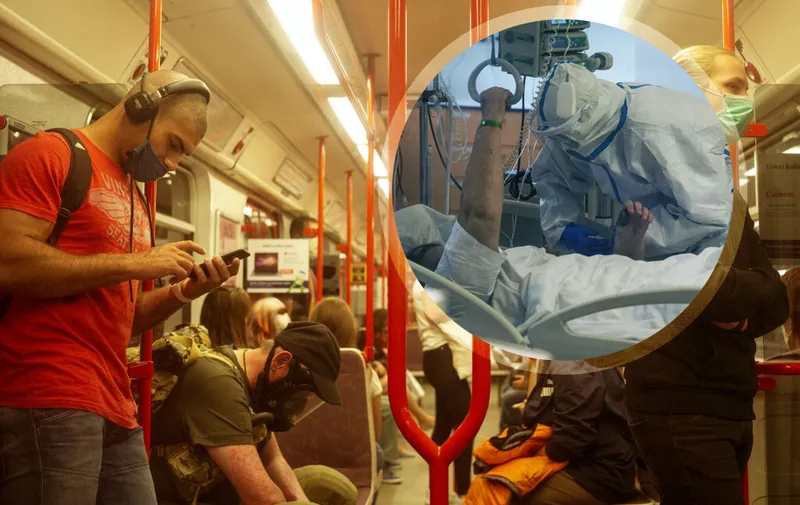 A man wearing gas mask sits on a metro train as other passengers wear faces masks, in Prague, on September 22, 2020. - According to health ministry data, the Czech Republic registered a record high of 3,130 coronavirus cases on September 17, 2020, almost matching the total for the whole of March 2020. (Photo by Michal Cizek / AFP)