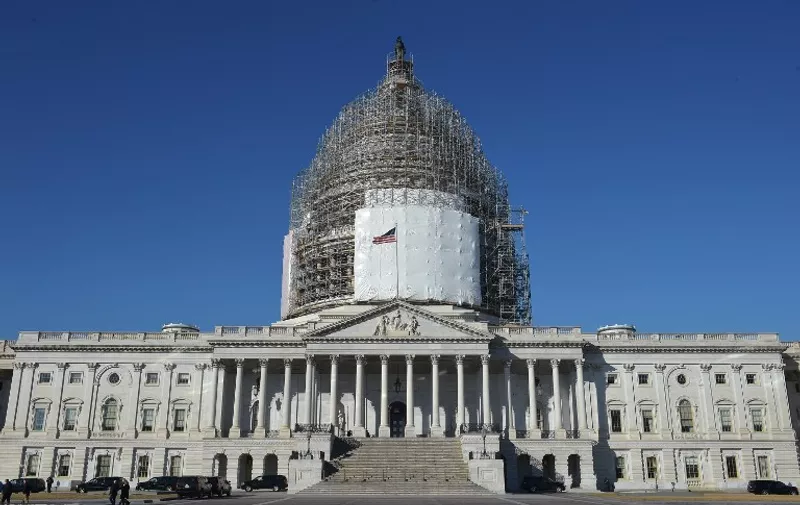 (FILES) This February 11, 2015 file photo shows the US Capitol in Washington, DC. American lawmakers voted overwhelmingly December 8, 2015 to impose restrictions making it more difficult for visitors to Iraq, Syria and countries listed as supporting terrorism to travel visa-free to the United States. The House of Representatives voted 407 to 19 in support of the Visa Waiver Program Improvement Act of 2015, a bill backed by the White House in the aftermath of the deadly attacks in Paris that were conducted by extremists who could have traveled to America without a visa.  AFP PHOTO/MANDEL NGAN / AFP / MANDEL NGAN