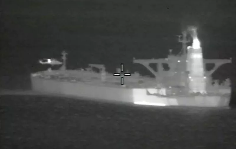 A handout picture released by the Ministry of Defence shows a night vision image of British Royal Marines taking part in the seizure of an Iranian oil tanker, Grace 1 in the early hours of July 4, 2019 off the Gibraltar strait. - Iran demanded on July 5, 2019 that Britain immediately release an oil tanker it has detained in Gibraltar, accusing it of acting at the bidding of the United States. (Photo by Handout / MOD / CROWN COPYRIGHT 2019 / AFP) / RESTRICTED TO EDITORIAL USE - MANDATORY CREDIT  " AFP PHOTO / CROWN COPYRIGHT 2013 "  -  NO MARKETING NO ADVERTISING CAMPAIGNS   -   DISTRIBUTED AS A SERVICE TO CLIENTS  -  NO ARCHIVE - TO BE USED WITHIN 2 DAYS FROM + DATE (48 HOURS), EXCEPT FOR MAGAZINES WHICH CAN PRINT THE PICTURE WHEN FIRST REPORTING ON THE EVENT /