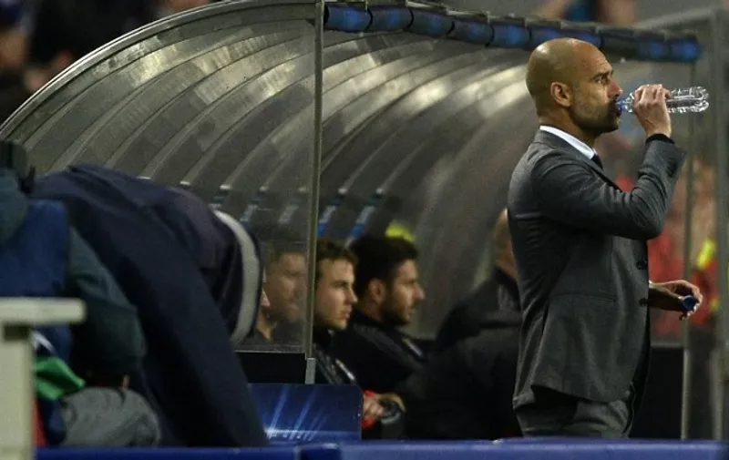 Bayern Munich&#8217;s Spanish coach Pep Guardiola drinks water during the UEFA Champions League quarter final football match FC Porto vs FC Bayern Munich at the at the Dragao stadium in Porto on April 15, 2015. AFP PHOTO /