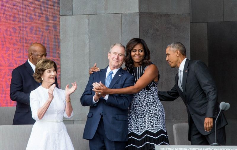 (L-R) Former US First Lady Laura Bush, former US President George W. Bush, First Lady Michelle Obama, and President Barack Obama attend the opening ceremony for the Smithsonian National Museum of African American History and Culture on September 24, 2016 in Washington, D.C.   / AFP PHOTO / ZACH GIBSON