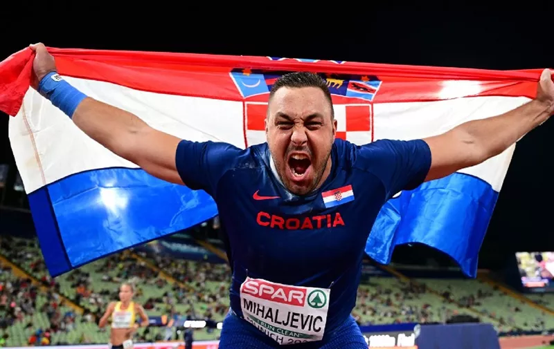 Croatia's Filip Mihaljevic celebrates winning gold in the men's Shot Put Final during the European Athletics Championships at the Olympic Stadium in Munich, southern Germany on August 15, 2022. (Photo by ANDREJ ISAKOVIC / AFP)