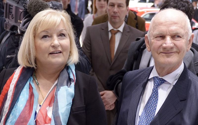 (FILES) A picture taken on April 19, 2012 shows Ferdinand Piech, supervisory board chairman of German auto giant Volkswagen (VW), and his wife Ursula Piech arriving for the company's annual general meeting in Hamburg, northern Germany. Piech has resigned with immediate effect, the German auto giant announced on April 25, 2015. Piech gave up all his positions in the group with immediate effect, along with his wife Ursula Piech. AFP PHOTO / OLIVER HARDT