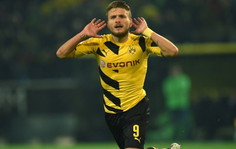 Dortmund's Italian striker Ciro Immobile celebrates during the German First division Bundesliga football match Borussia Dortmund v VfL Wolfsburg in Dortmund, Germany, on December 17, 2014.  AFP PHOTO / PATRIK STOLLARZ

RESTRICTIONS - DFL RULES TO LIMIT THE ONLINE USAGE DURING MATCH TIME TO 15 PICTURES PER MATCH. FOR FURTHER QUERIES PLEASE CONTACT DFL DIRECTLY AT + 49 69 650050