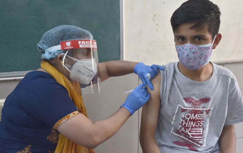 A health worker administers a shot of Covid-19 vaccine, a young 19 Year old Boy at Govt. Boys Sr. Sec School , Janta Flat, GTB Enclave (Nand Nagri)  on  May 4, 2021 in New Delhi, India.
COVID-19 Vaccination Drive, New Delhi, Delhi, India - 04 May 2021,Image: 609275772, License: Rights-managed, Restrictions: , Model Release: no, Credit line: Profimedia