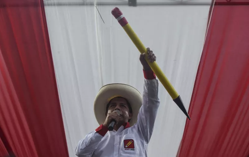 (FILES) In this file photo taken on May 25, 2021 Peruvian left-wing presidential candidate for Peru Libre party, Pedro Castillo, delivers a speech as he holds a big pencil, simbol of the party, during a campaign rally ahead of the runoff election. - Peru's Congress on December 7, 2022 voted to impeach President Pedro Castillo, ignoring his decision to dissolve the legislature just hours earlier. (Photo by ERNESTO BENAVIDES / AFP)