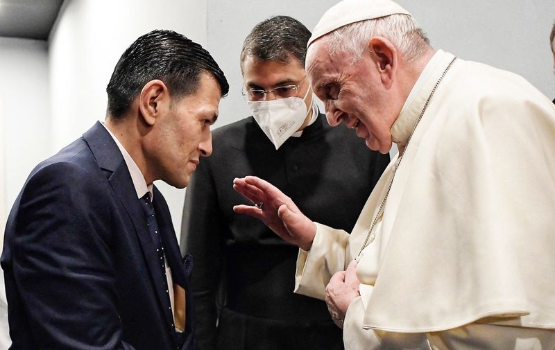 Pope Francis meets Abdullah Kurdi, the father of the 3-year-old Syrian boy whose lifeless body washed up on a Turkish beach in September 2015, after the mass celebrated at Erbil's Franso Hariri Stadium in northern Iraq on March 7, 2021. The brutal images of Mr. Kurdi's dead son, Alan (known in Turkish as Aylan), spread widely on social networks and pricked the consciences of millions for whom the plight of Syrian refugees risking their lives to reach Europe had previously been abstract. Mr. Kurdi also lost his wife, Rehanna, and another son, Galeb, 5, when a small boat bound for Greece capsized.The 4-day historical visit to Iraq is the first papal international trip since the star of the Covid-19 pandemic. Photo : Vatican Media via ABACAPRESS.COM
