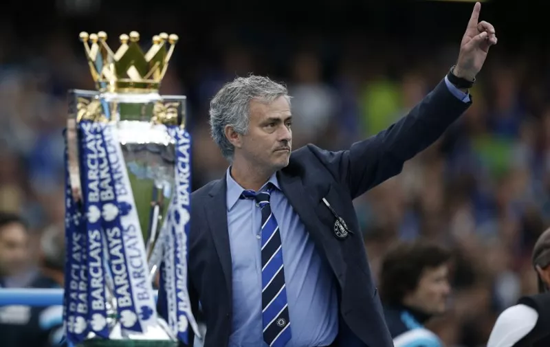 Chelsea's Portuguese manager Jose Mourinho (R) gestures during the presentation of the Premier League trophy after the English Premier League football match between Chelsea and Sunderland at Stamford Bridge in London on May 24, 2015. Chelsea were officially crowned the 2014-2015 Premier League champions.  AFP PHOTO / ADRIAN DENNIS

RESTRICTED TO EDITORIAL USE. NO USE WITH UNAUTHORIZED AUDIO, VIDEO, DATA, FIXTURE LISTS, CLUB/LEAGUE LOGOS OR LIVE SERVICES. ONLINE IN-MATCH USE LIMITED TO 45 IMAGES, NO VIDEO EMULATION. NO USE IN BETTING, GAMES OR SINGLE CLUB/LEAGUE/PLAYER PUBLICATIONS.