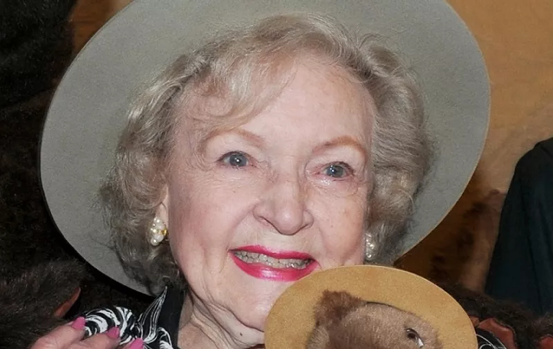Actress Betty White, holdsa small stuffed Smokey Bear at the ceremony making her an Honorary Forest Service Ranger at the Kennedy Center in Washington, DC on Nov. 9, 2010.