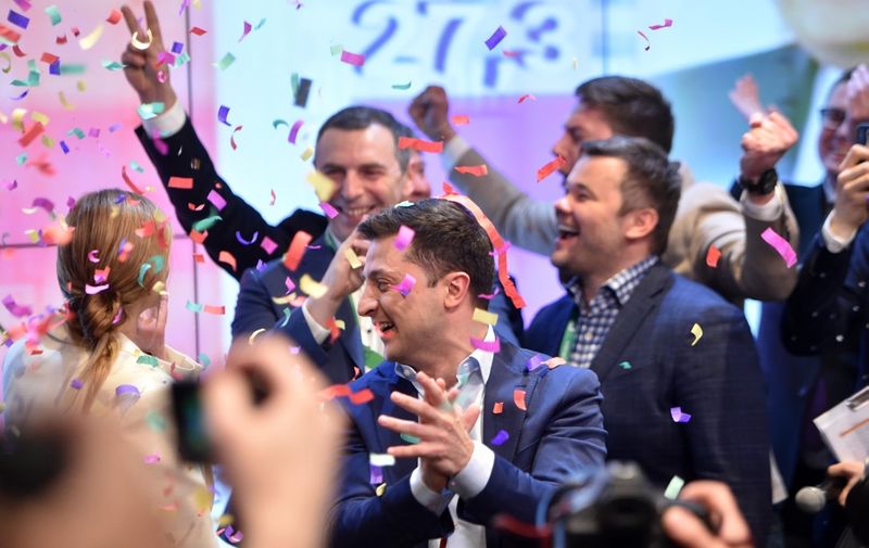 Ukrainian comedian and presidential candidate Volodymyr Zelensky reacts after the announcement of the first exit poll results in the second round of Ukraine's presidential election at his campaign headquarters in Kiev on April 21, 2019. (Photo by Sergei GAPON / AFP)