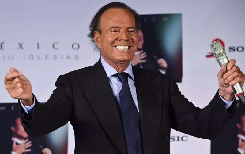 Spanish singer Julio Iglesias gestures during a press conference in Mexico city, on September 23, 2015. Iglesias is in Mexico to promote his new album "Mexico". AFP PHOTO/RONALDO SCHEMIDT