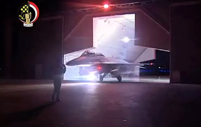 An image grab taken from Egypt's state-run television station Al-Masriya on February 16, 2015 reportedly shows a Egyptian F-16 fighter jet preparing to take off in the early morning from an undisclosed location to conduct air strikes against Islamic State (IS) group targets in Libya. Egypt carried out air strikes against IS targets in Libya after the jihadists posted a video on February 15 showing the decapitation of 21 Egyptian Coptic Christians. AFP PHOTO / HO / EGYPTIAN TV 
 EDITOR'S NOTE - RESTRICTED TO EDITORIAL USE - MANDATORY CREDIT "AFP PHOTO / HO / AL-MASRIYA TV" - NO MARKETING NO ADVERTISING CAMPAIGNS - DISTRIBUTED AS A SERVICE TO CLIENTS == / AFP / EGYPTIAN TV / -