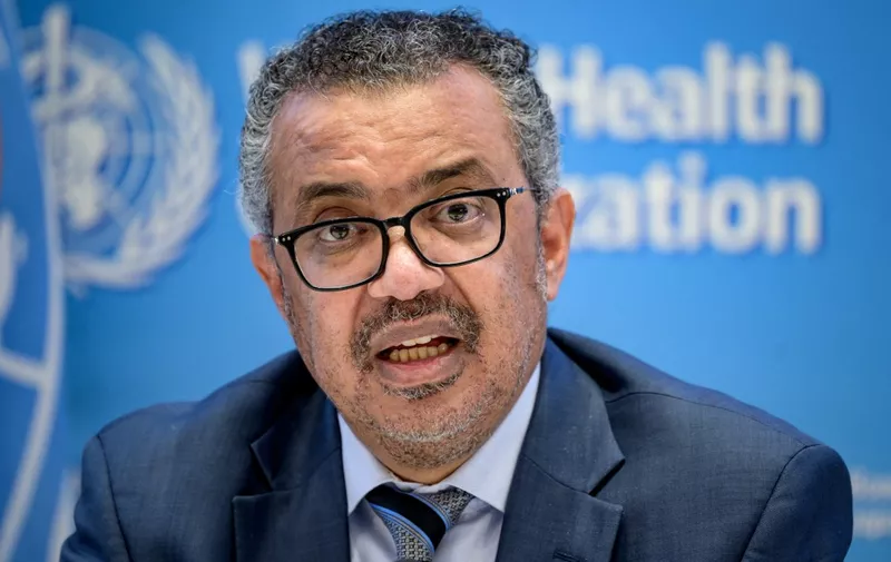 (FILES) In this file photograph taken on December 20, 2021, World Health Organization (WHO) Director-General Tedros Adhanom Ghebreyesus gives a press conference at WHO headquarters in Geneva. - A tsunami of cases from both the Omicron and Delta variants of Covid-19 will push health systems towards the brink of collapse, the World Health Organization warned December 29, 2021. (Photo by Fabrice COFFRINI / AFP)