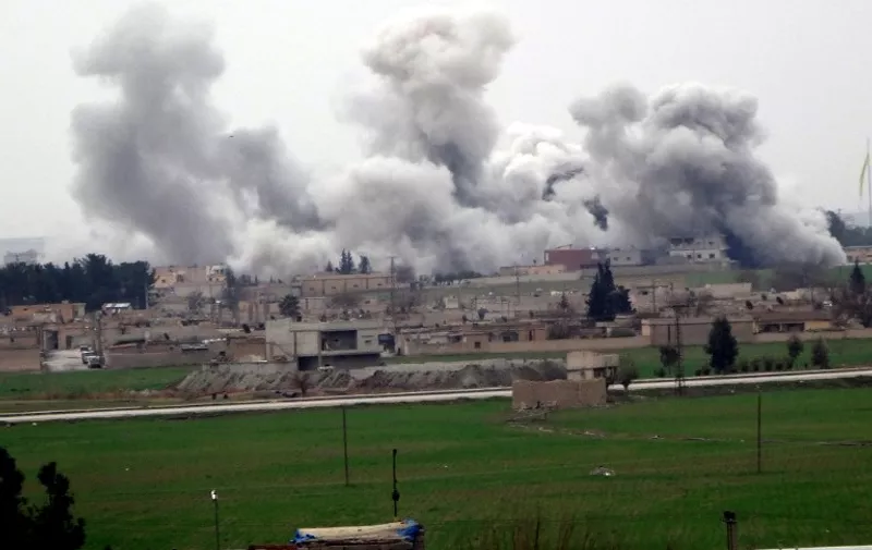 A picture taken on February 27, 2016 in Akcakale in Sanliurfa province shows smoke rising from the neightbourhood of Syrian city Tel Abyad during clashes between Islamic State Group and People's Protection Units (YPG).
ussian Foreign Minister Sergei Lavrov and US Secretary of State John Kerry "hailed" the ceasefire in Syria and discussed ways of supporting it through cooperation between their militaries, Russia's foreign ministry said on February 27, 2016. / AFP / STR
