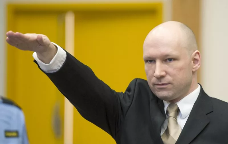 Norwegian mass killer Anders Behring Breivik makes a Nazi salute as he arrives to a makeshift court in Skien prisons gym on March 15, 2016 in Skien, some 130 km south west of Oslo, for his lawsuit against the Norwegian state, which he accuses of violating his human rights by holding him in isolation.
Rightwing extremist Anders Behring Breivik is serving a maximum 21-year sentence for killing 77 people -- eight in a bomb attack outside a government building in Oslo and another 69, most of them teenagers, in a rampage at a Labour Youth camp on the island of Utoya in July 2011. / AFP / JONATHAN NACKSTRAND