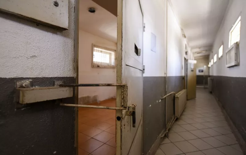 This picture taken on June 15, 2020 shows a door inside a disused prison in Pristina on June 15, 2020. - The Pristina's Prison, in the centre of the Kosovo capital, was built in 1951 during the Communist era and used to hold political detainees when Kosovo was part of Yugoslavia. It was  shut down in 2016 after continuing complaints about poor conditions at the detention facility. Kosovos government decided to reopen it for visitors and to begin transforming it into a museum. (Photo by Armend NIMANI / AFP)