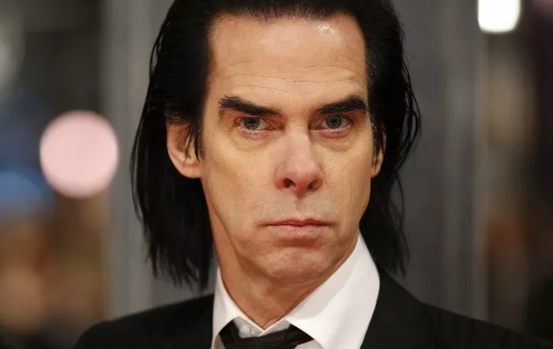 British musician Nick Cave poses on the red carpet for the BAFTA British Academy Film Awards at the Royal Opera House in London on February 8, 2015. AFP PHOTO / JUSTIN TALLIS