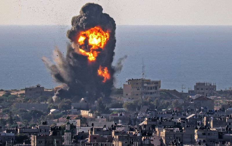 Smoke billows from an explosion following an Israeli air strike in Rafah in the southern Gaza Strip on May 13, 2021. (Photo by SAID KHATIB / AFP)
