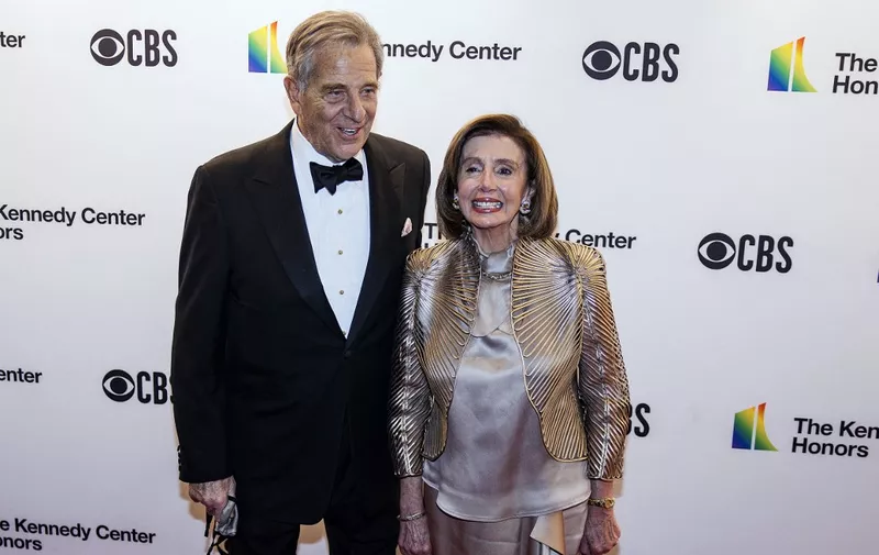 (FILES) In this file photo taken on December 05, 2021, US Speaker of the House of Representatives Nancy Pelosi (R) and husband Paul Pelosi attend the 44th Kennedy Center Honors at the Kennedy Center in Washington, DC. - An intruder attacked Paul Pelosi after breaking into his home in San Francisco on early on October 28, 2022, the office of Spaker Pelosi said, leaving him needing hospital treatment.  "Early this morning, an assailant broke into the Pelosi residence in San Francisco and violently assaulted Mr. Pelosi," the Democratic leader's spokesman Drew Hammill said in a statement. (Photo by Samuel Corum / AFP)