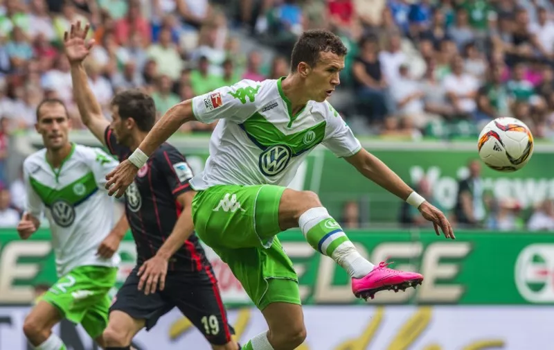 Wolfsburg's Croatian midfielder Ivan Perisic controls the ball during the German first division Bundesliga football match VfL Wolfsburg vs Eintracht Frankfurt in Wolfsburg, northern Germany, on August 16, 2015.  AFP PHOTO / JOHN MACDOUGALL

RESTRICTIONS: DURING MATCH TIME: DFL RULES TO LIMIT THE ONLINE USAGE TO 15 PICTURES PER MATCH AND FORBID IMAGE SEQUENCES TO SIMULATE VIDEO. 
== RESTRICTED TO EDITORIAL USE ==
FOR FURTHER QUERIES PLEASE CONTACT DFL DIRECTLY AT + 49 69 650050.